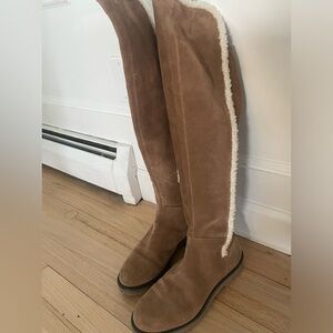 Camel color suede boots with sheerling white trim. Warm once.